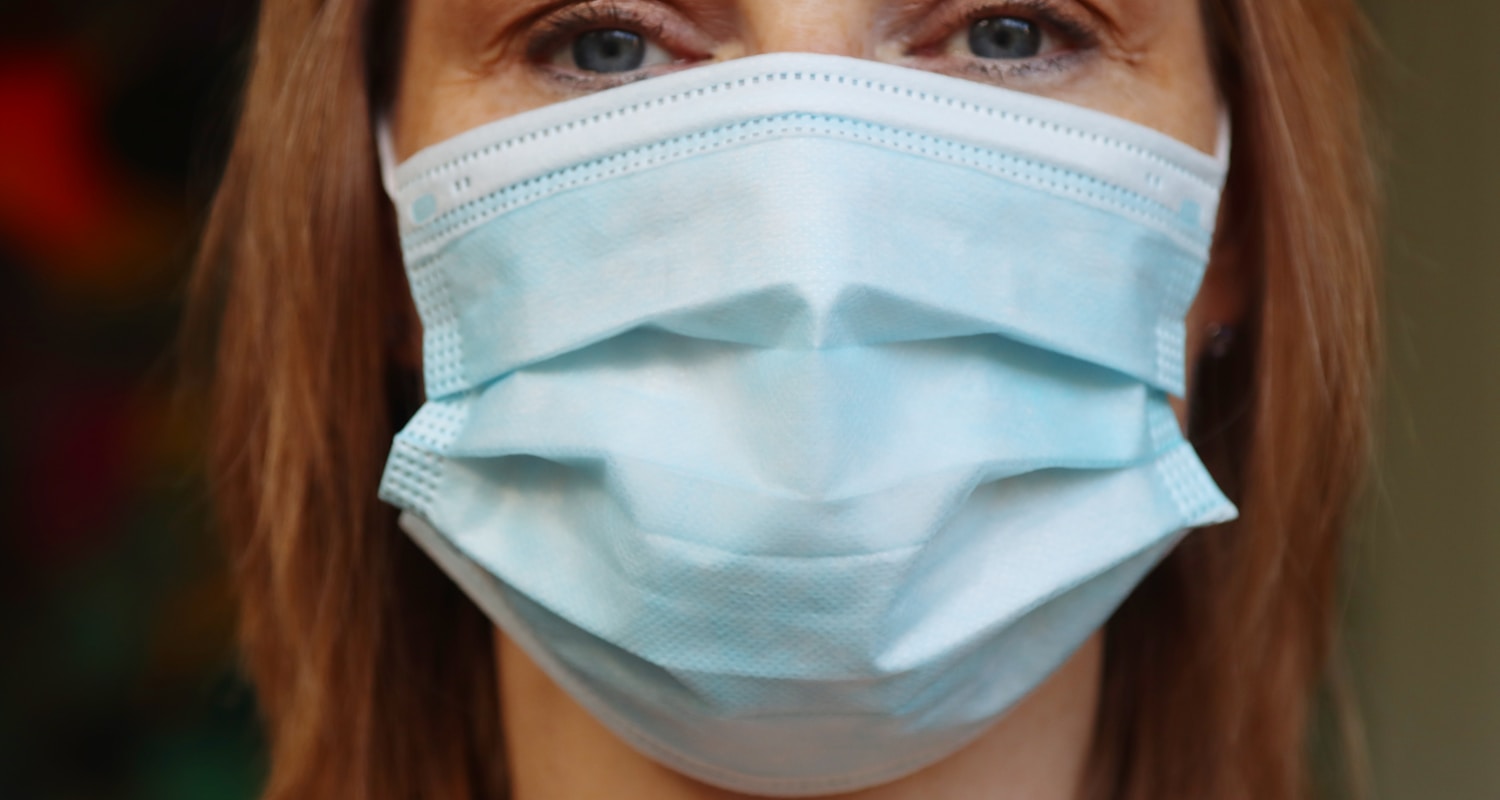 woman in white face mask