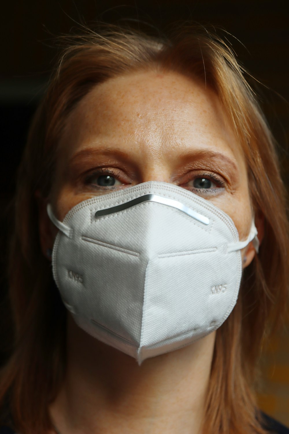 woman wearing white face mask