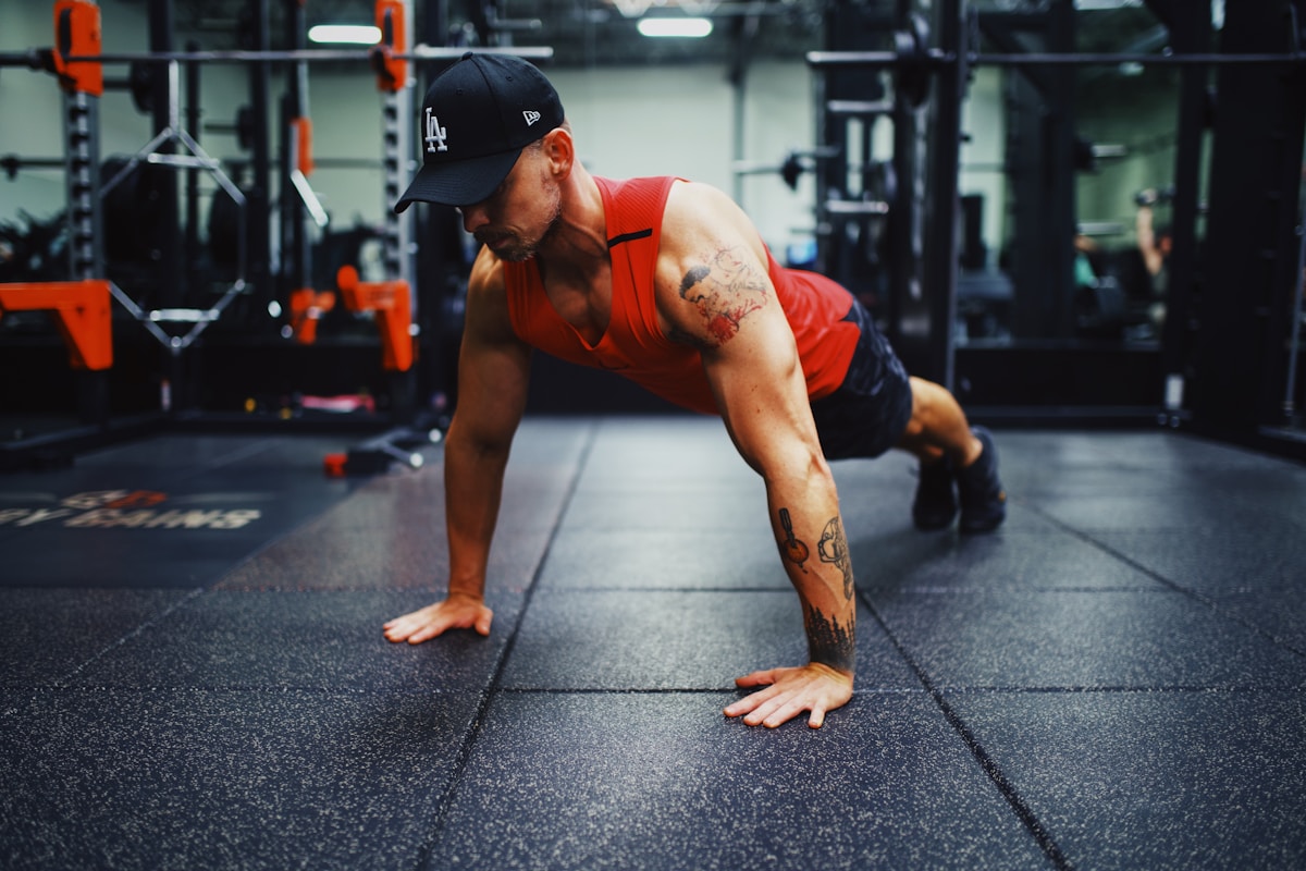 Young person doing a push-up at home on a yoga mat