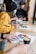 A diverse team collaborating around a table with charts and graphs displayed.