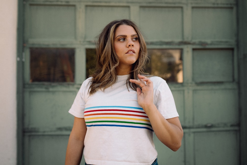 woman in white red blue and yellow striped t-shirt