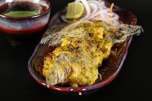 A vibrant dish of pollo a la brasa served with sides.