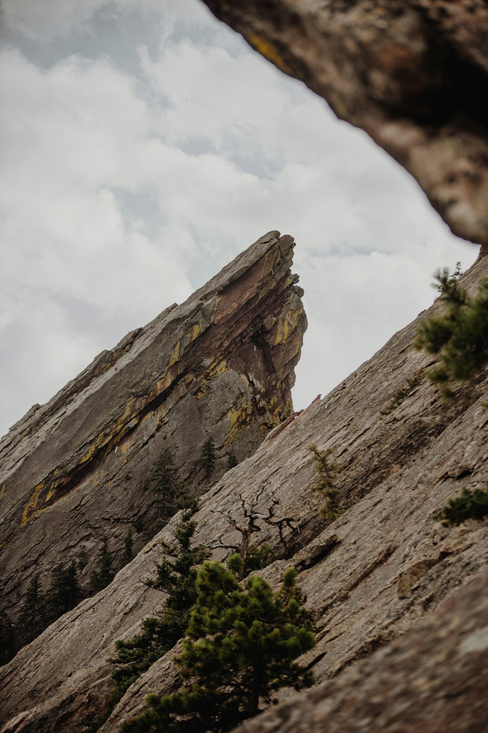 brown rocky mountain under white cloudy sky during daytime