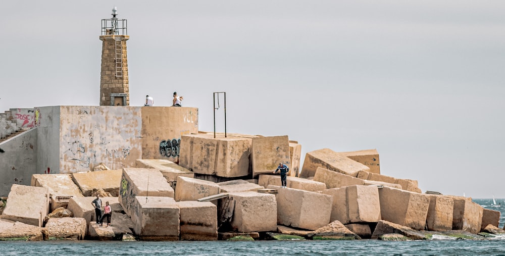 brown concrete building near body of water during daytime