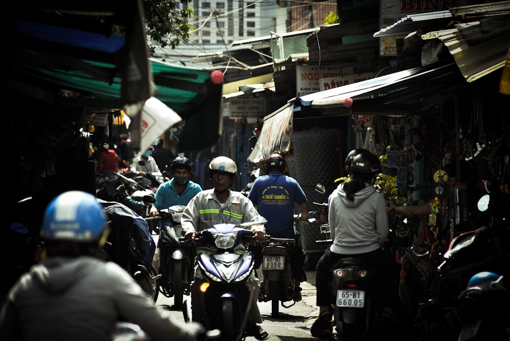 people riding motorcycle on road during daytime