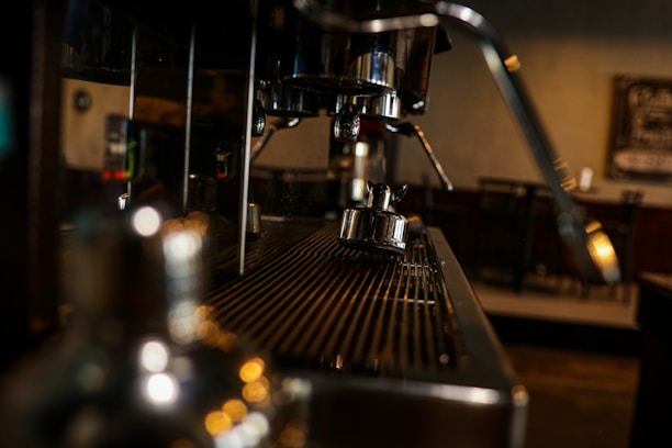 Close-up of freshly cleaned coffee machine in a cozy cafe setting.