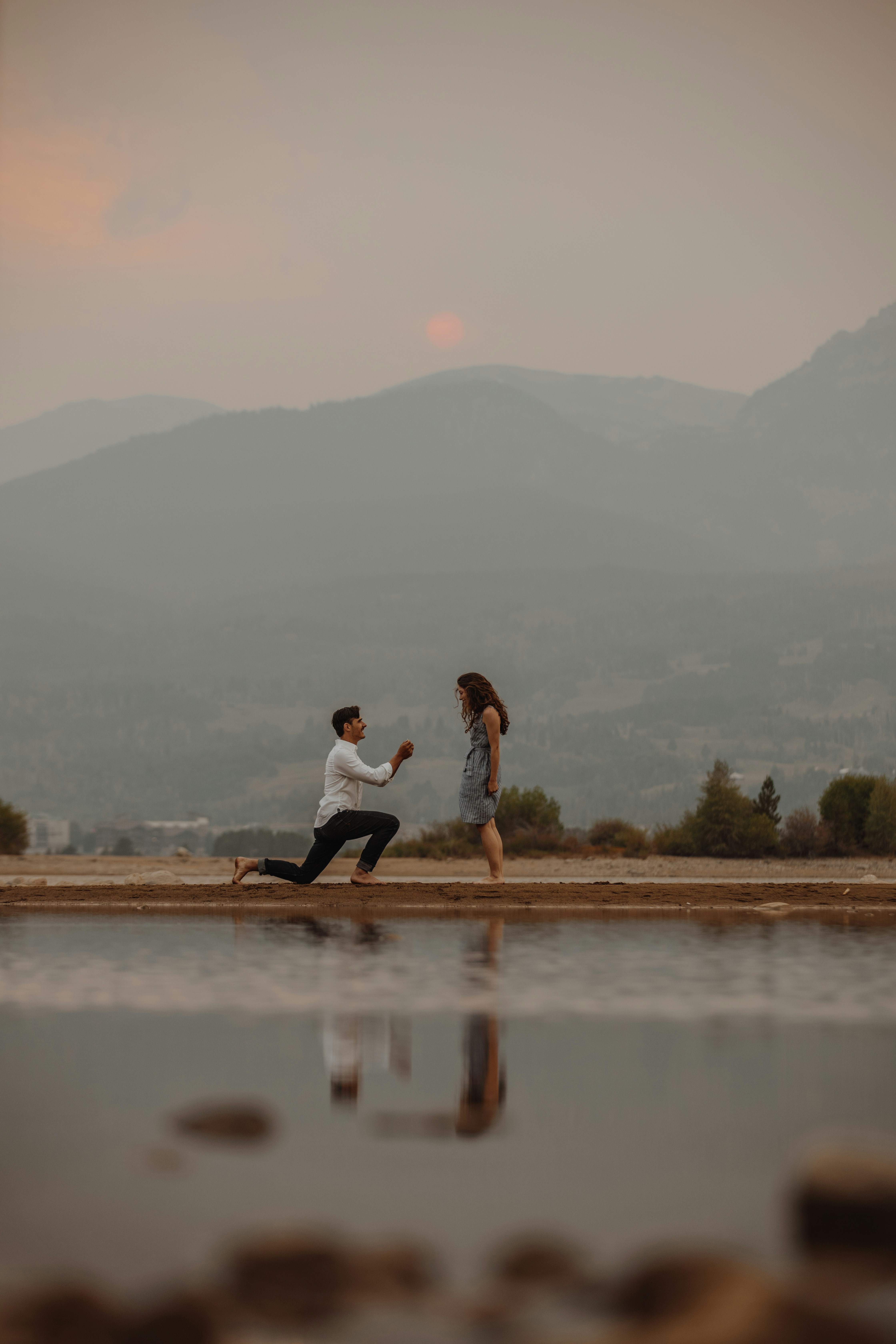 great photo recipe,how to photograph man in white shirt and black pants sitting on brown wooden dock during daytime