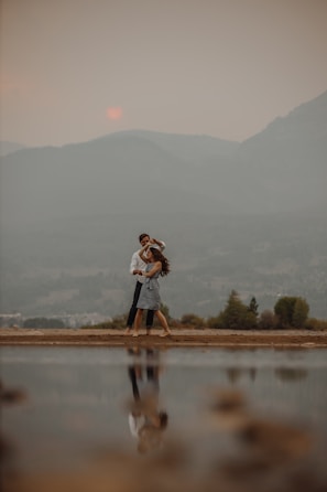 Couple embracing on a misty mountain trail in Urubici at sunrise