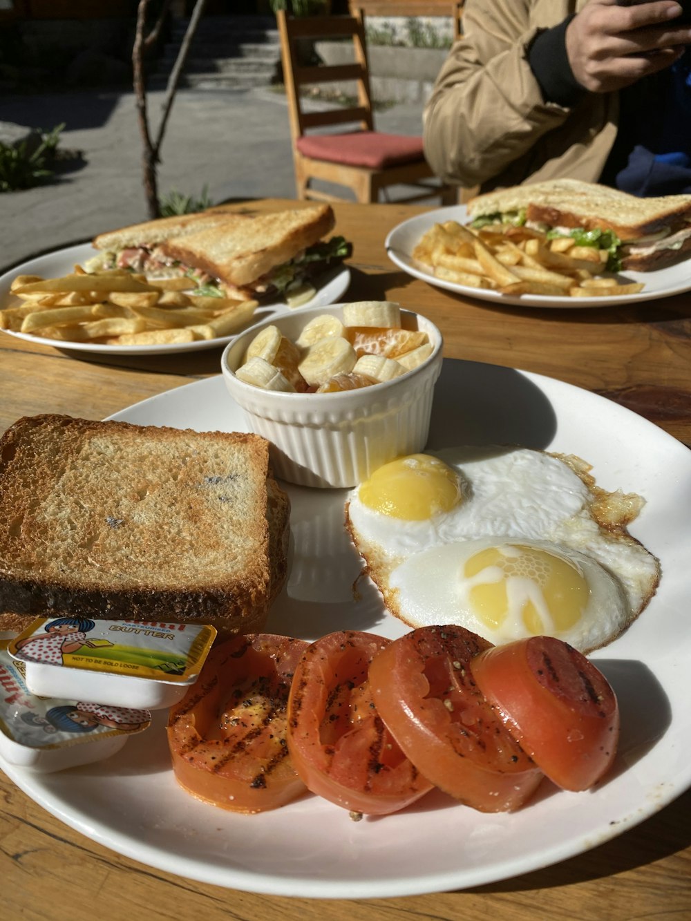 bread with egg and sausage on white ceramic plate