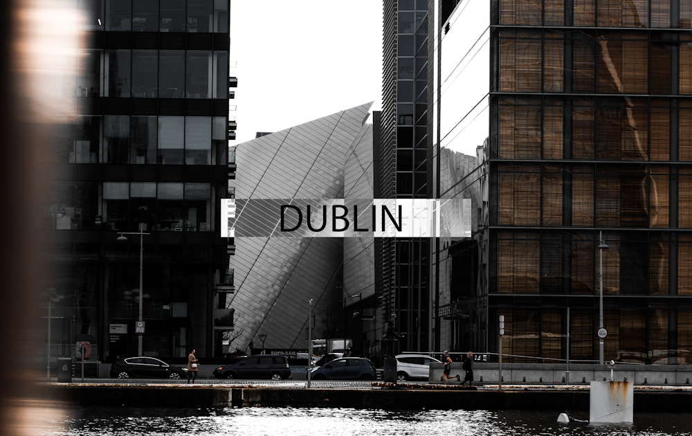 brown and gray building near body of water during daytime