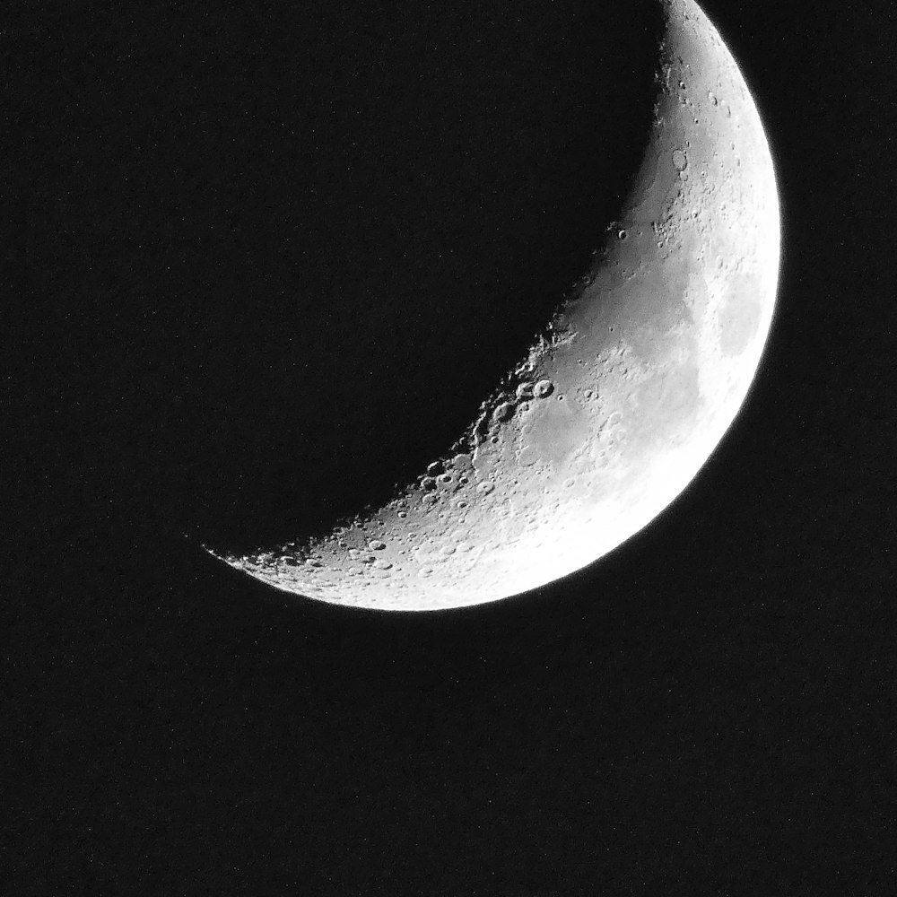 grayscale photo of moon and stars