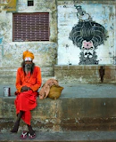 2 men sitting on brown concrete bench