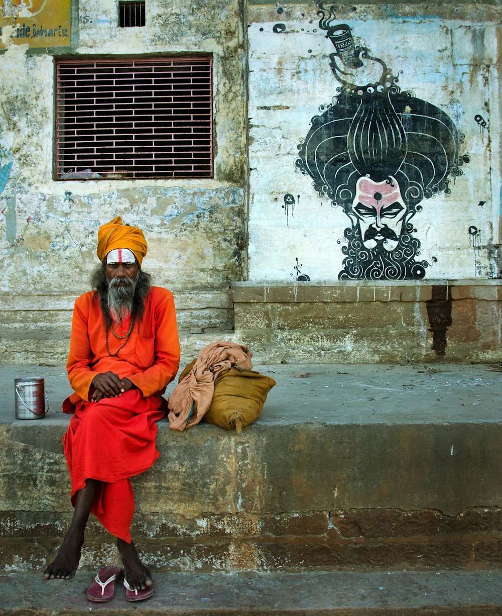 2 men sitting on brown concrete bench