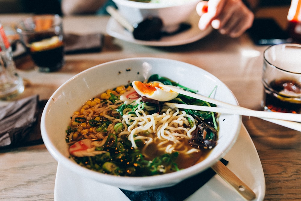 white ceramic bowl with noodle soup