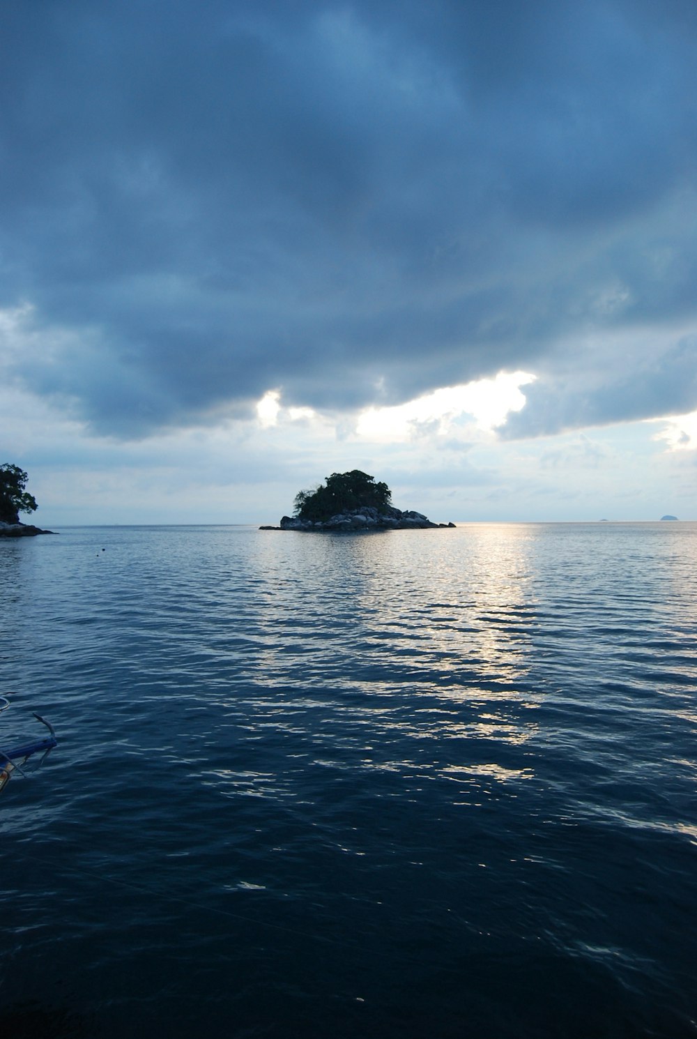 body of water under cloudy sky during daytime