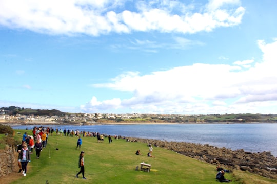 people on beach during daytime in Cornwall United Kingdom