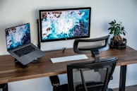 silver imac on brown wooden table