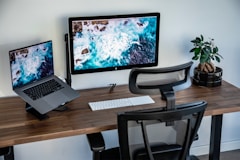 silver imac on brown wooden table