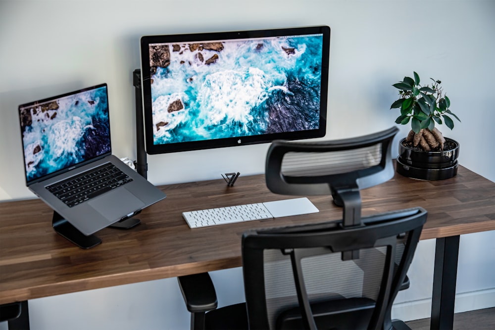 silver imac on brown wooden table