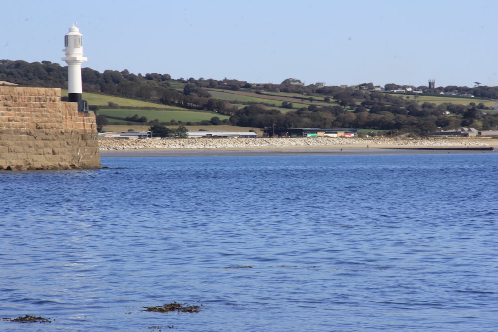 brown rock formation on sea during daytime