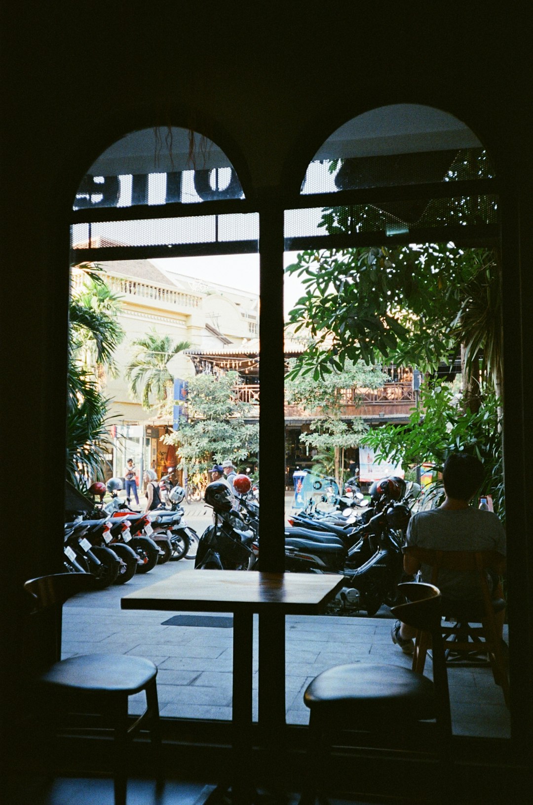 people sitting on chairs near table during daytime