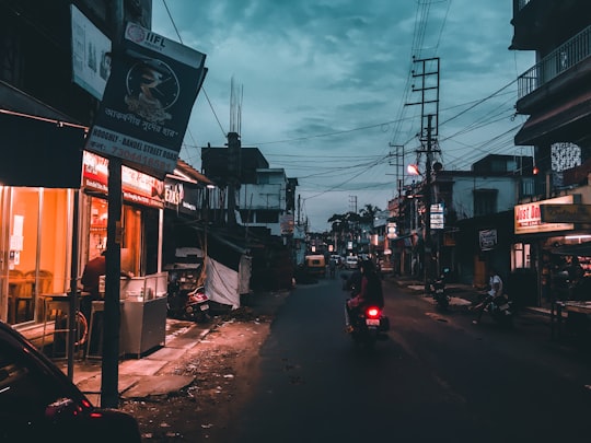 cars on road near buildings during daytime in West Bengal India