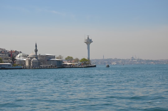 white tower near body of water during daytime in Üsküdar Turkey