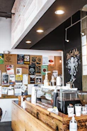 A vibrant 360-degree view capturing the cozy interior of a bustling artisanal coffee shop.
