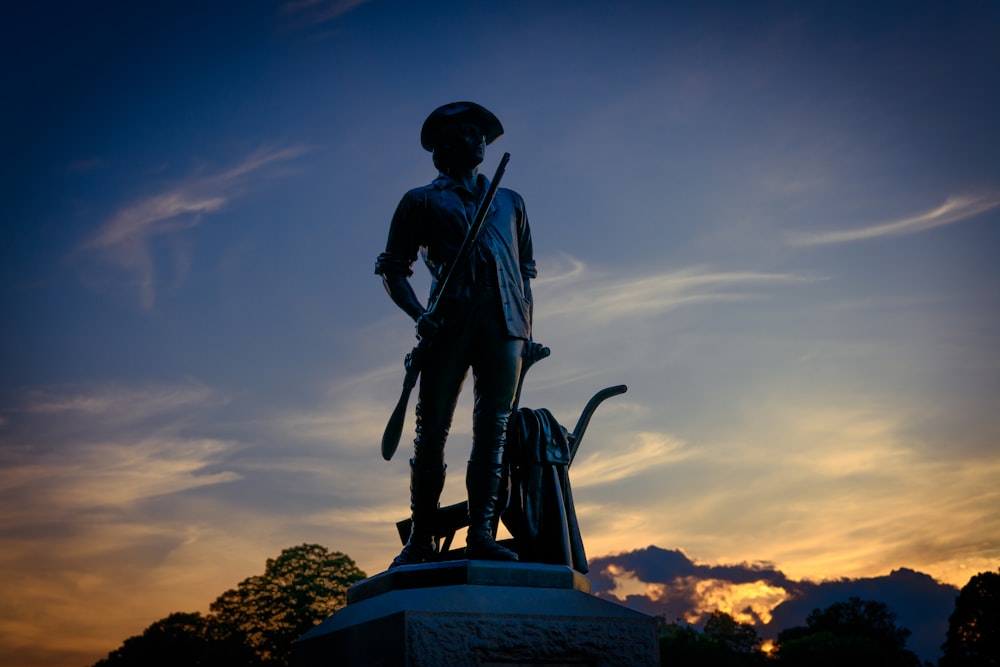 man in black jacket statue