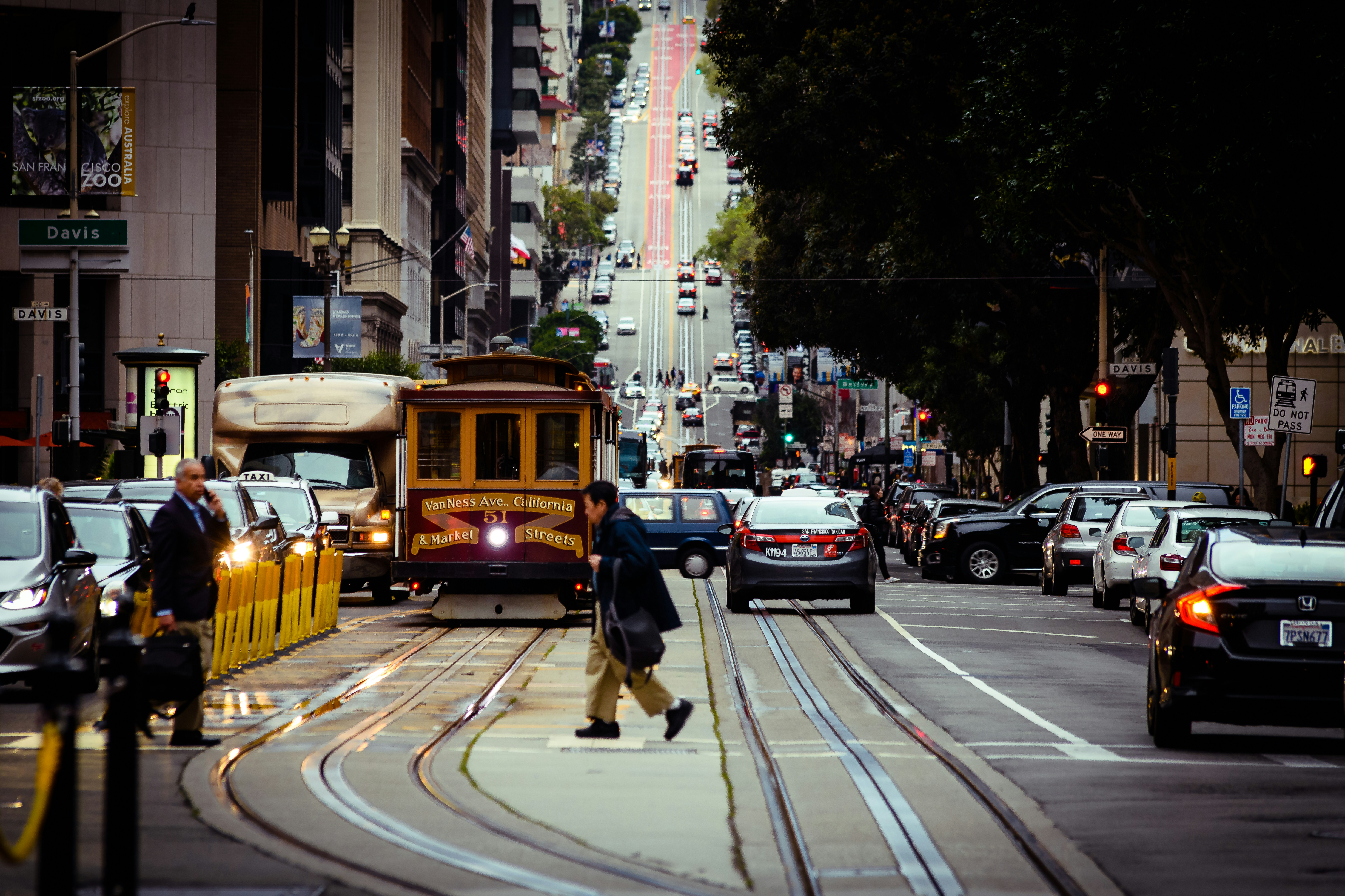 cars on road near buildings during daytime