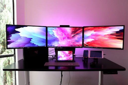 black flat screen tv on white wooden table