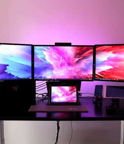 black flat screen tv on white wooden table