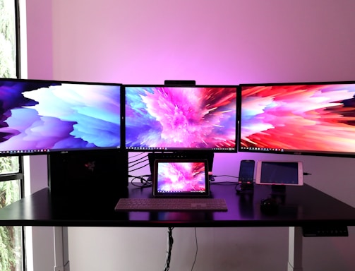 black flat screen tv on white wooden table