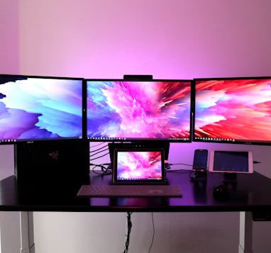 black flat screen tv on white wooden table