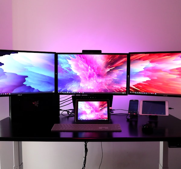 black flat screen tv on white wooden table