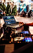 person using macbook pro on table