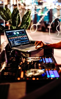 person using macbook pro on table