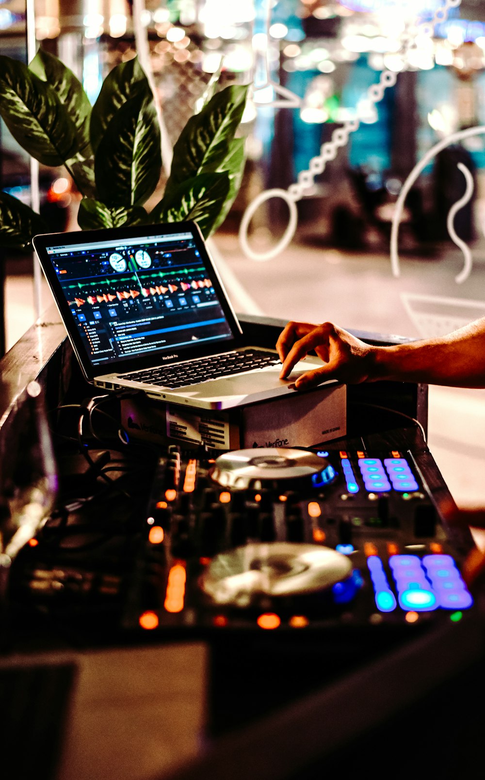 person using macbook pro on table