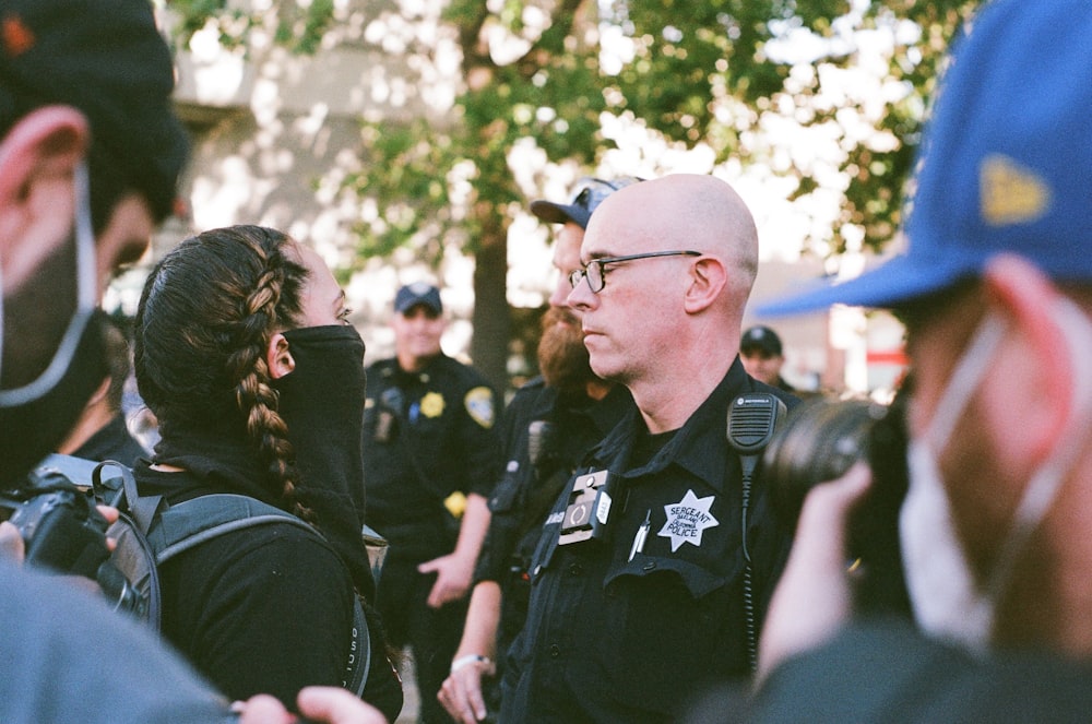 man in black polo shirt wearing eyeglasses