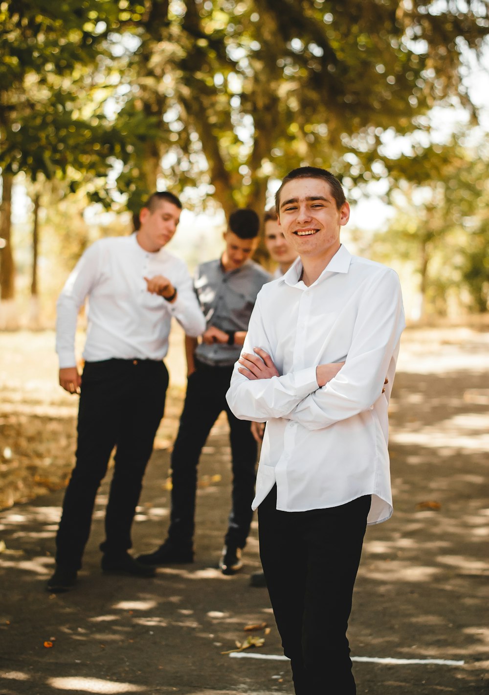 man in white dress shirt standing beside man in white dress shirt