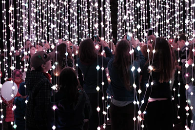 Guests snapping photos in front of the photo-ready trailer backdrop, capturing memories and sharing on social media.
