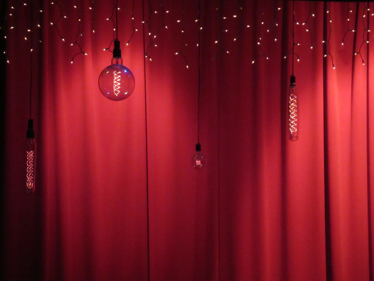 Draped backdrop with gold and purple lighting