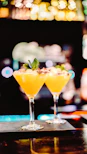 yellow liquid in clear cocktail glass