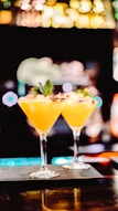 yellow liquid in clear cocktail glass