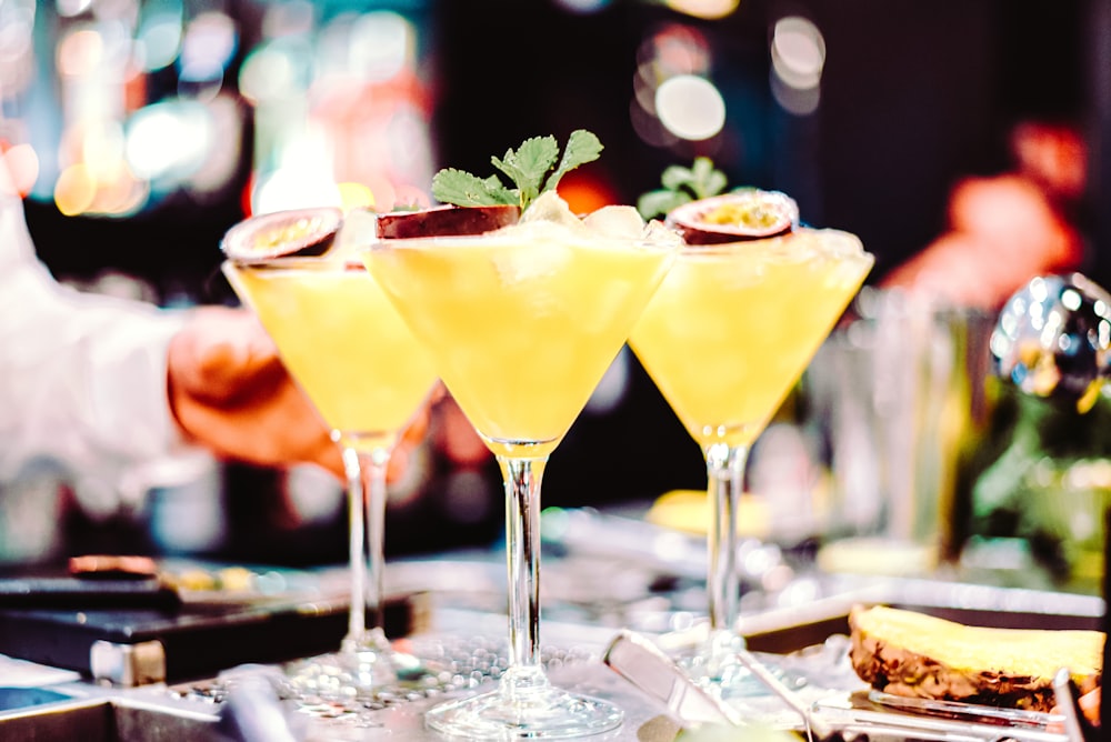 yellow liquid in clear cocktail glass