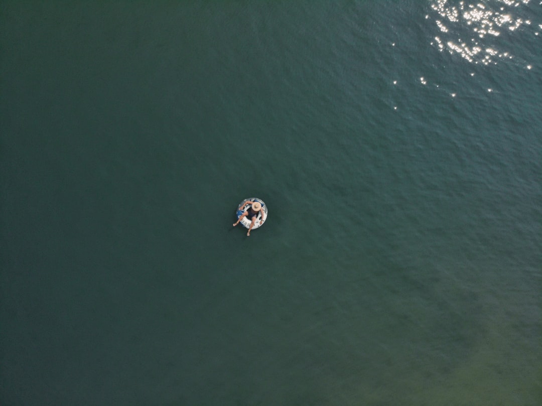 aerial view of white boat on body of water during daytime