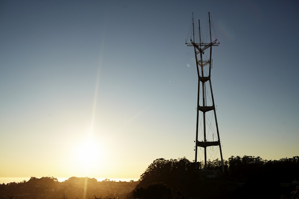 silhouette of wind mill during sunset