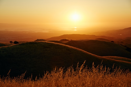 Sunset over rolling hills of a California gold country ranch.