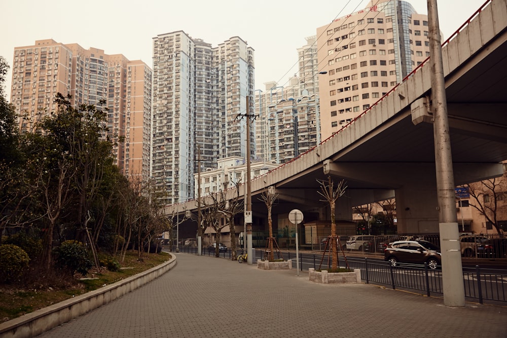 white and brown concrete building near green trees during daytime