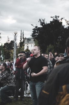 Brian Cowles speaking at a community event in Joplin, engaging with local residents.
